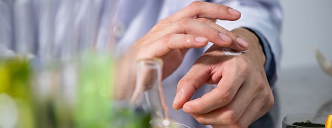 Person applying skincream to their hand