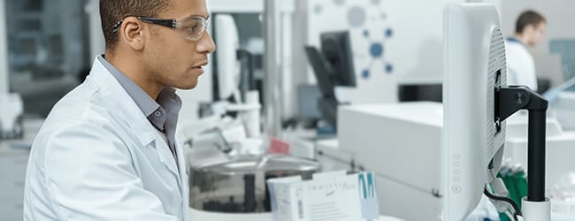 Scientist using a computer in a lab
