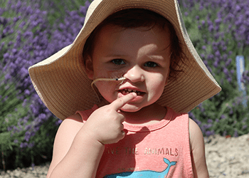child with a feeding tube looking into the camera
